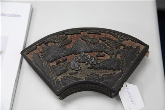 A Chinese black and cinnabar lacquer fan shaped box and cover, 19th century, 25cm, some damage